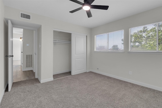 18010 Santolina Ln, Katy, TX 77449 - unfurnished bedroom featuring carpet floors, multiple windows, a closet, and baseboards