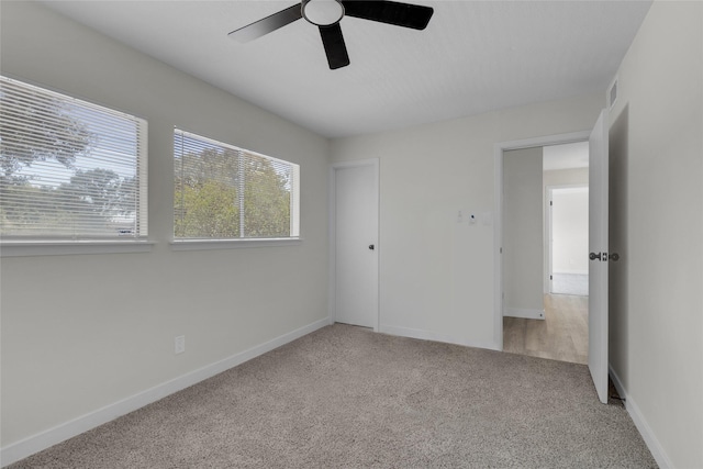 18010 Santolina Ln, Katy, TX 77449 - unfurnished bedroom featuring carpet floors, baseboards, and ceiling fan