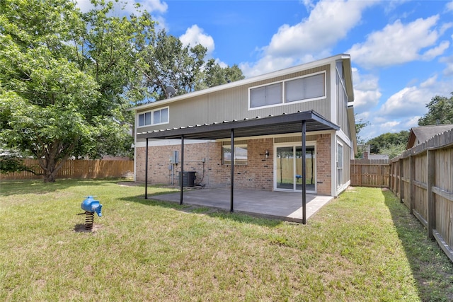 18010 Santolina Ln, Katy, TX 77449 - rear view of property with brick siding, central AC unit, and a patio area
