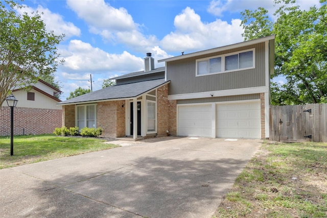 18010 Santolina Ln, Katy, TX 77449 - view of front facade featuring brick siding, concrete driveway, a chimney, and a garage