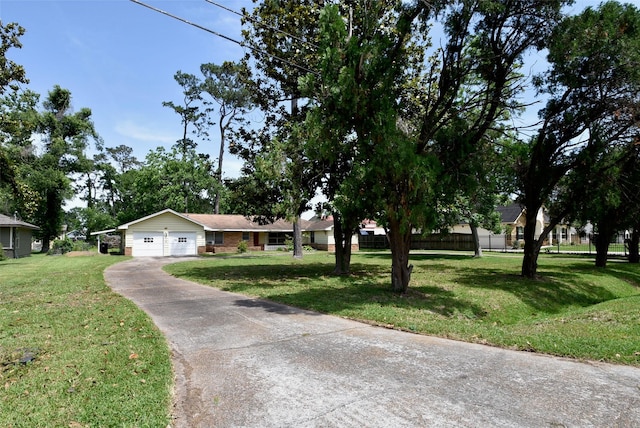 5216 Sue Marie Ln, Houston, TX 77091 - view of front of property featuring an attached garage, a front yard, driveway, and brick siding