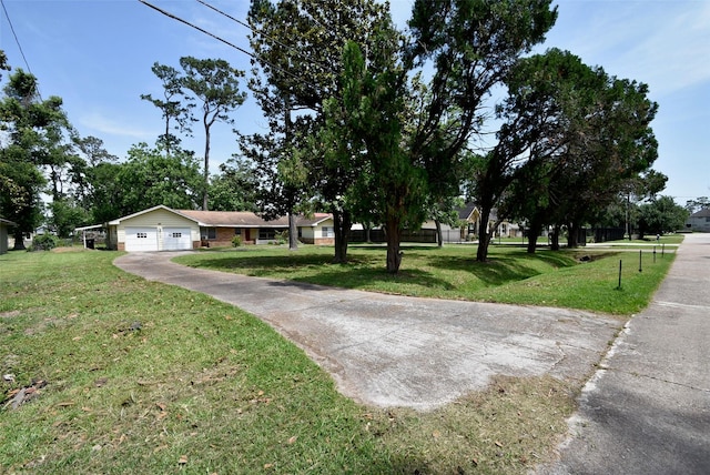 5216 Sue Marie Ln, Houston, TX 77091 - view of front of property featuring a front yard, an attached garage, and driveway