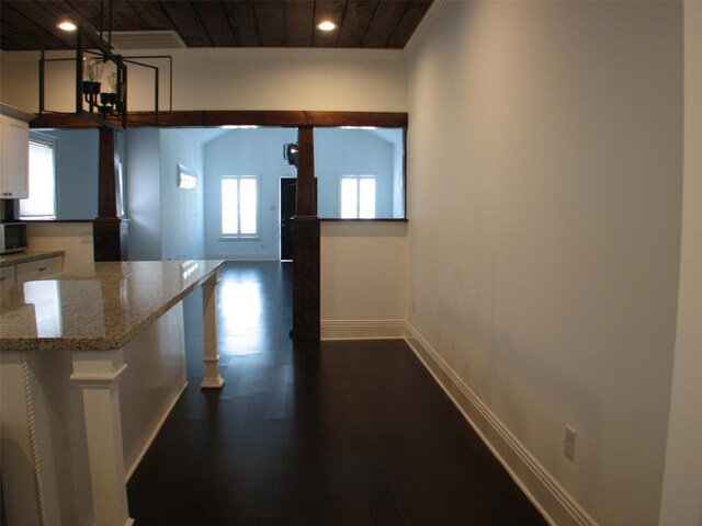 2405 Keene St, Houston, TX 77009 - kitchen featuring white cabinets, wooden ceiling, baseboards, recessed lighting, and dark wood-style flooring