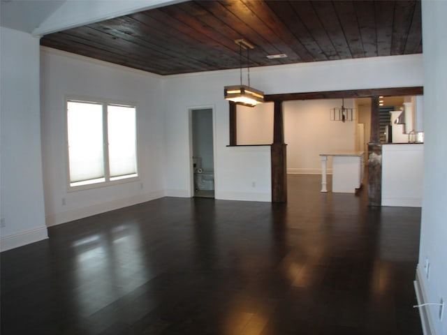 2405 Keene St, Houston, TX 77009 - unfurnished living room with wood ceiling, dark wood-style floors, and baseboards