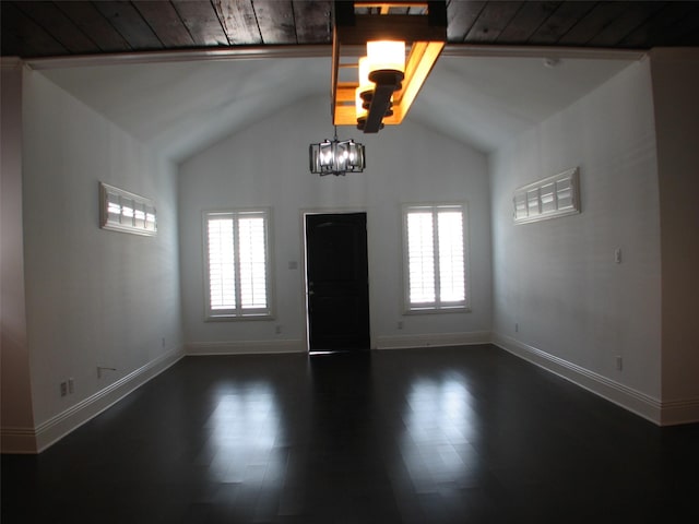 2405 Keene St, Houston, TX 77009 - foyer with lofted ceiling, dark wood-style floors, a chandelier, and baseboards