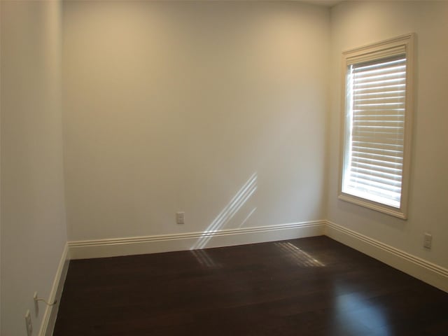 2405 Keene St, Houston, TX 77009 - unfurnished room with dark wood finished floors and baseboards