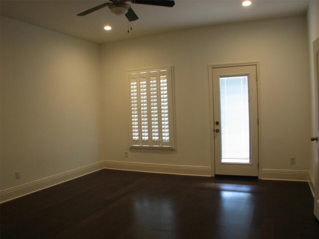 2405 Keene St, Houston, TX 77009 - unfurnished room featuring ceiling fan, dark wood-style floors, recessed lighting, plenty of natural light, and baseboards