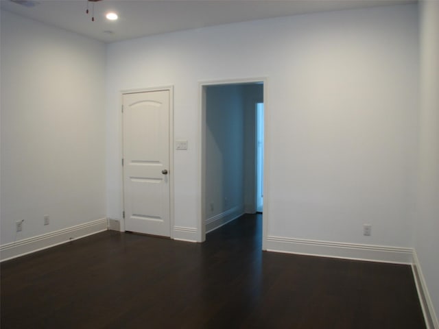 2405 Keene St, Houston, TX 77009 - unfurnished room with dark wood-style flooring, baseboards, recessed lighting, and a ceiling fan