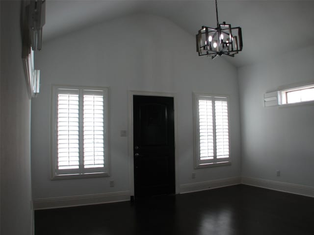 2405 Keene St, Houston, TX 77009 - entryway featuring healthy amount of natural light, a chandelier, baseboards, dark wood-style flooring, and high vaulted ceiling