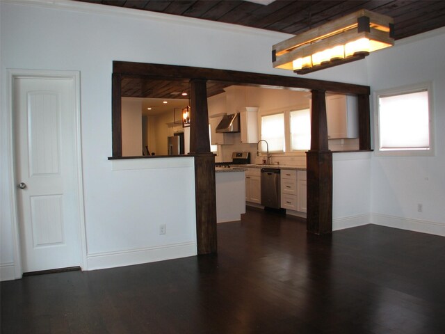 2405 Keene St, Houston, TX 77009 - unfurnished living room featuring ornate columns, a sink, baseboards, dark wood-style floors, and wood ceiling