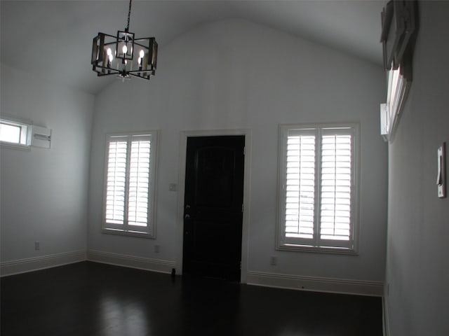 2405 Keene St, Houston, TX 77009 - foyer with a chandelier, baseboards, dark wood-style flooring, and high vaulted ceiling