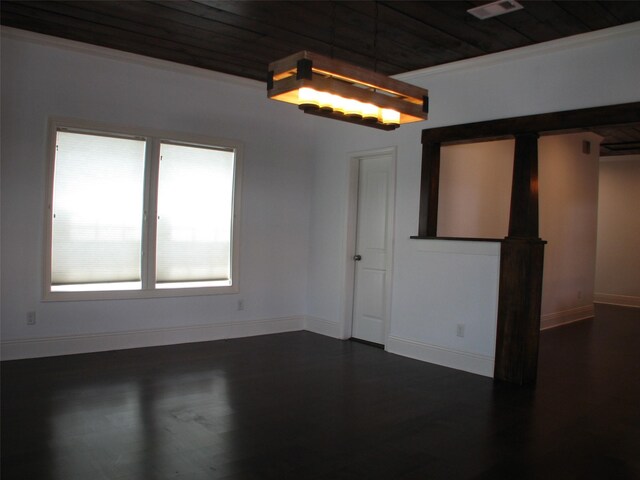 2405 Keene St, Houston, TX 77009 - empty room featuring wooden ceiling, dark wood finished floors, and baseboards