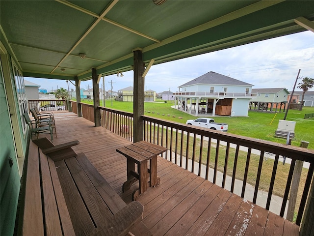 970 Olive Dr, Crystal Beach, TX 77650 - wooden deck featuring a residential view and a lawn