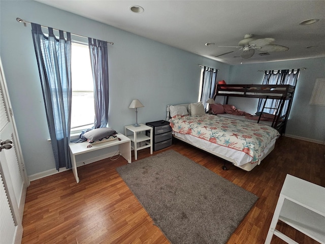 970 Olive Dr, Crystal Beach, TX 77650 - bedroom featuring multiple windows, wood finished floors, baseboards, and recessed lighting