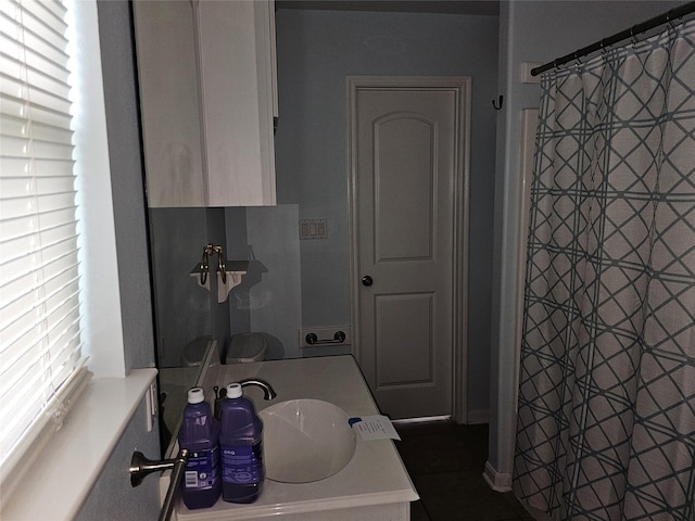 970 Olive Dr, Crystal Beach, TX 77650 - full bath featuring vanity, tile patterned floors, and curtained shower