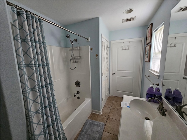 970 Olive Dr, Crystal Beach, TX 77650 - full bathroom with tile patterned flooring, shower / tub combo, and vanity
