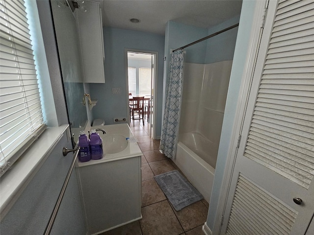 970 Olive Dr, Crystal Beach, TX 77650 - bathroom featuring tile patterned floors, vanity, and shower / bath combo with shower curtain