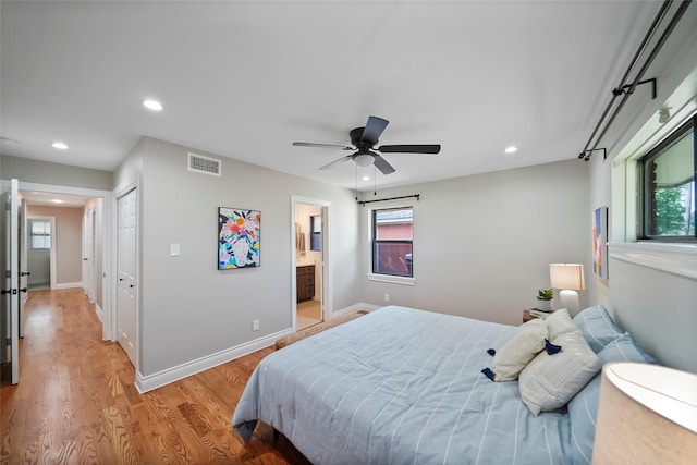 4266 T C Jester Blvd, Houston, TX 77018 - bedroom with recessed lighting, light wood finished floors, baseboards, ensuite bath, and a closet