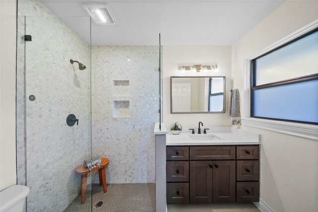 4266 T C Jester Blvd, Houston, TX 77018 - bathroom featuring tiled shower, vanity, and toilet