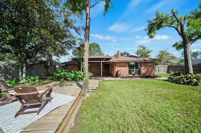 4266 T C Jester Blvd, Houston, TX 77018 - rear view of property featuring a wooden deck, brick siding, and a chimney