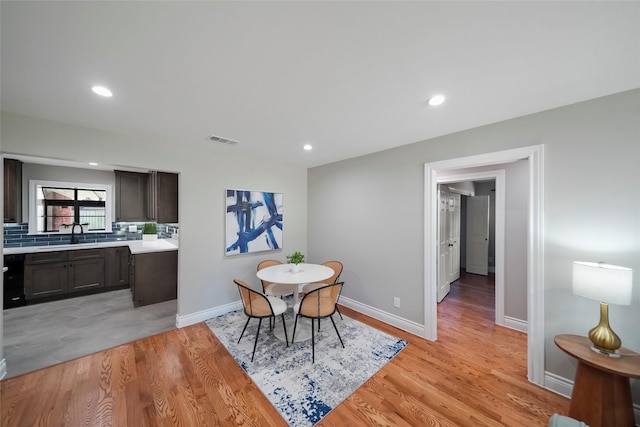 4266 T C Jester Blvd, Houston, TX 77018 - dining area with light wood-type flooring, baseboards, and recessed lighting