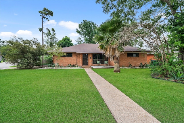 4266 T C Jester Blvd, Houston, TX 77018 - ranch-style house with brick siding and a front yard