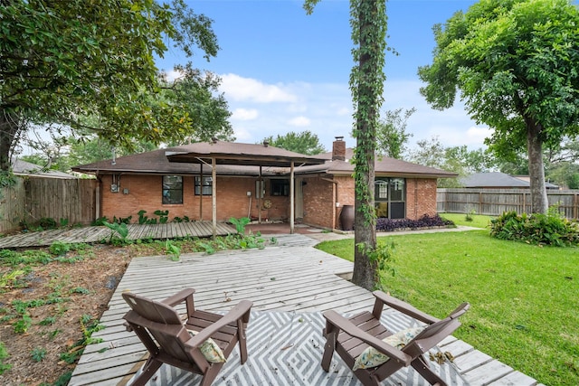 4266 T C Jester Blvd, Houston, TX 77018 - rear view of property featuring brick siding, a wooden deck, and a chimney