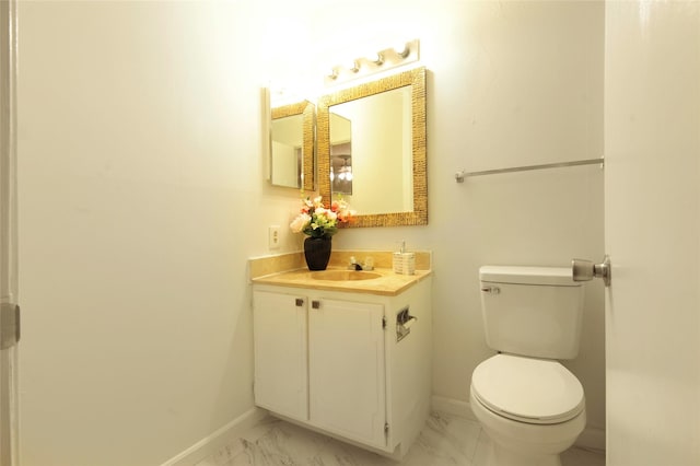 4164 Belle Park Dr Unit 4164, Houston, TX 77072 - half bathroom with baseboards, marble finish floors, toilet, and vanity