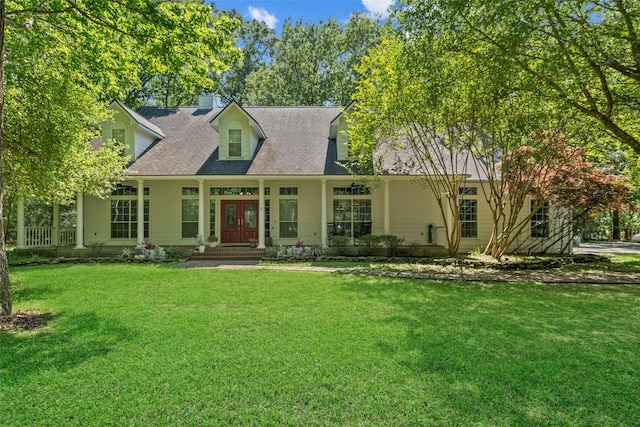 cape cod house with french doors, a front lawn, a chimney, and covered porch
