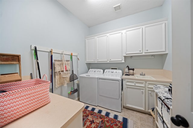 laundry room featuring cabinet space and independent washer and dryer