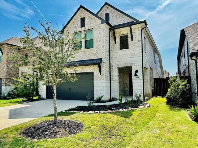 7014 Anacua Berry Cir, Katy, TX 77493 - french country inspired facade featuring a garage, driveway, and stone siding