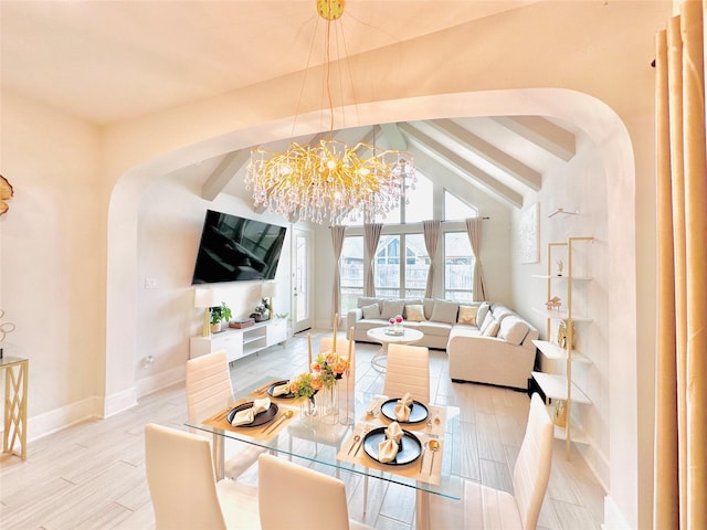 7014 Anacua Berry Cir, Katy, TX 77493 - living room with arched walkways, baseboards, and a chandelier