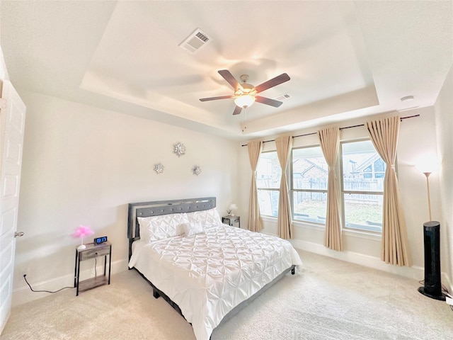 7014 Anacua Berry Cir, Katy, TX 77493 - bedroom featuring a tray ceiling, carpet, baseboards, and ceiling fan