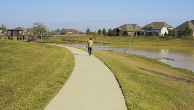 7014 Anacua Berry Cir, Katy, TX 77493 - view of community with a water view and a yard