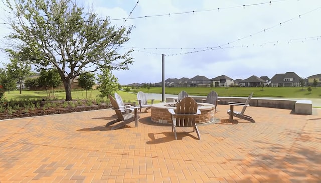 7014 Anacua Berry Cir, Katy, TX 77493 - view of patio / terrace featuring an outdoor fire pit and a residential view