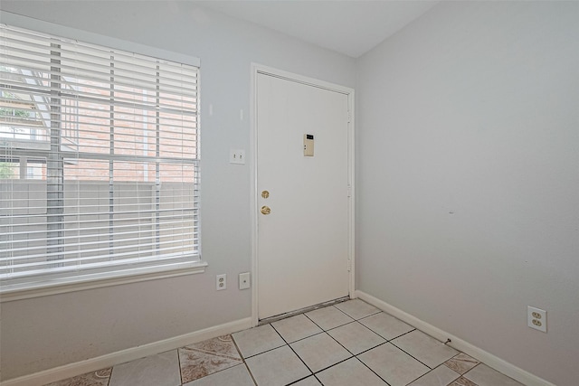 2250 Bering Dr Unit 101, Houston, TX 77057 - foyer entrance with healthy amount of natural light, baseboards, and light tile patterned floors