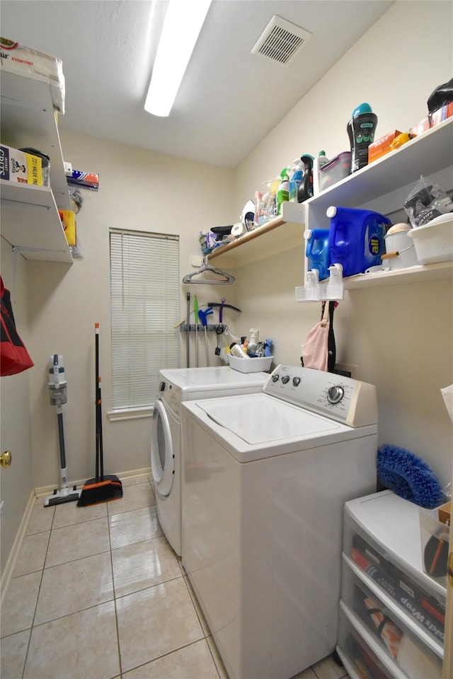 20815 Crimson Oak Trl, Humble, TX 77346 - laundry area with separate washer and dryer, light tile patterned flooring, and baseboards