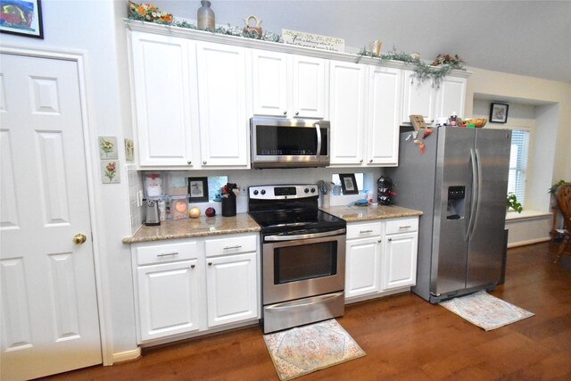 20815 Crimson Oak Trl, Humble, TX 77346 - kitchen with stainless steel appliances, dark wood-style flooring, white cabinetry, and light stone counters