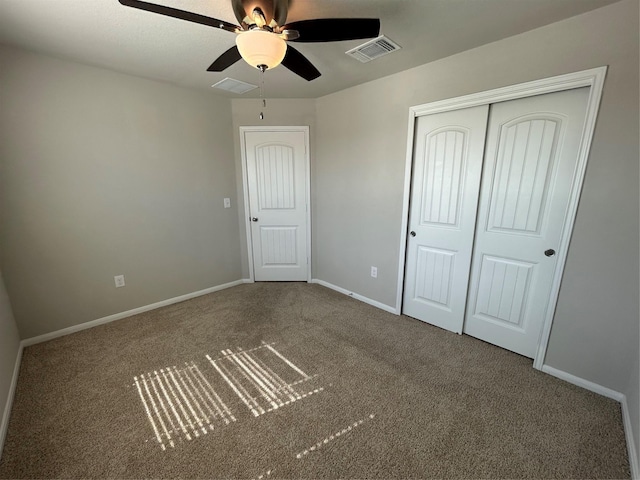 2002 Arborside Dr, Austin, TX 78754 - unfurnished bedroom with carpet, a closet, baseboards, and a ceiling fan
