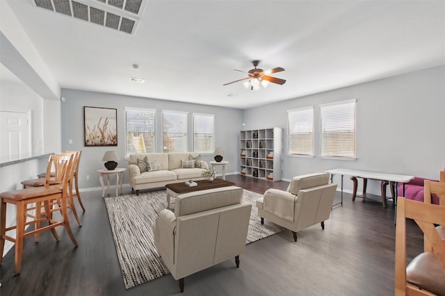 1193 Stallion Rdg, Alvin, TX 77511 - living area featuring a ceiling fan, wood finished floors, and baseboards