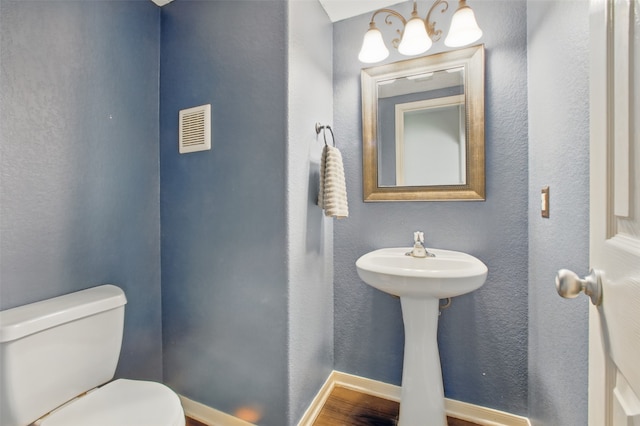 1193 Stallion Rdg, Alvin, TX 77511 - bathroom with toilet, baseboards, and a sink