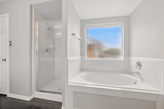1193 Stallion Rdg, Alvin, TX 77511 - full bath featuring a stall shower, healthy amount of natural light, a bath, and wood finished floors
