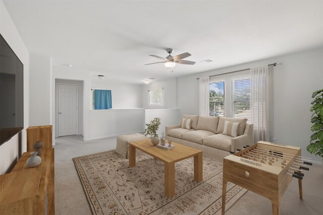 1193 Stallion Rdg, Alvin, TX 77511 - living area with carpet, a ceiling fan, and baseboards