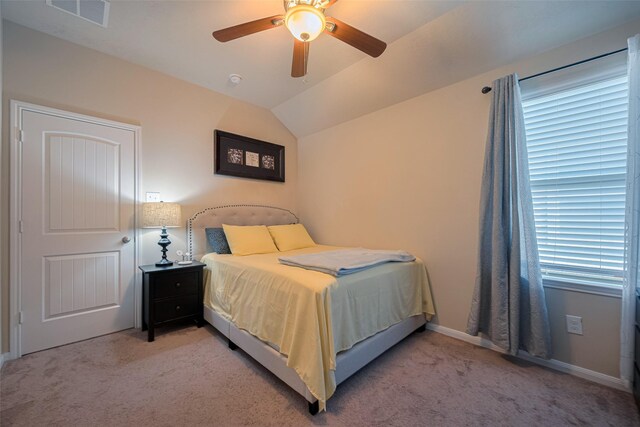 8113 E Pine Creek Bnd, Cypress, TX 77433 - bedroom with light carpet, lofted ceiling, a ceiling fan, and baseboards