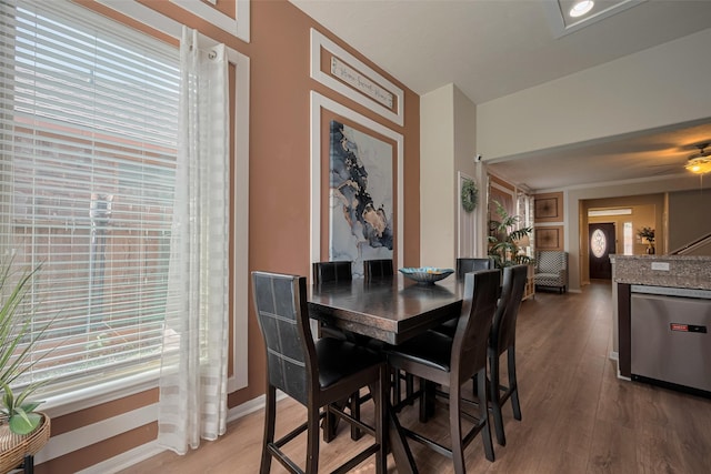 8113 E Pine Creek Bnd, Cypress, TX 77433 - dining room with light wood-type flooring, baseboards, and ceiling fan