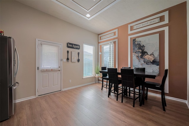 8113 E Pine Creek Bnd, Cypress, TX 77433 - dining room featuring wood finished floors, baseboards, and recessed lighting