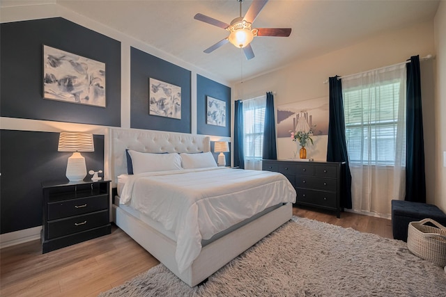 8113 E Pine Creek Bnd, Cypress, TX 77433 - bedroom with light wood-style floors and ceiling fan