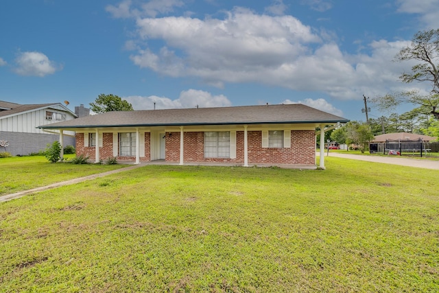 722 Dell Dale St, Channelview, TX 77530 - view of front facade with a front yard, a chimney, and brick siding