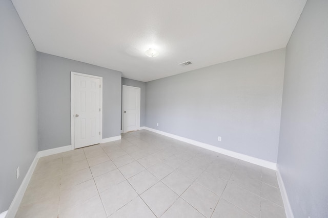 722 Dell Dale St, Channelview, TX 77530 - unfurnished bedroom featuring baseboards and light tile patterned flooring