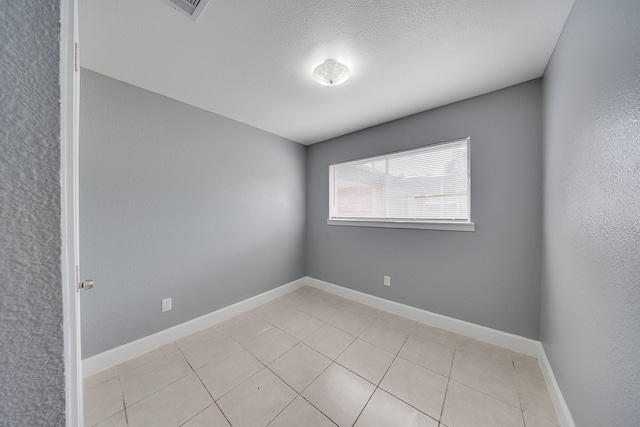 722 Dell Dale St, Channelview, TX 77530 - empty room with light tile patterned floors and baseboards